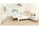 Main bedroom featuring neutral carpet, and upholstered headboard, and a bedside table at 2730 Burtz Dr, Marietta, GA 30068