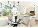Charming breakfast nook with large windows and views of the landscaped backyard at 2730 Burtz Dr, Marietta, GA 30068