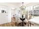 Bright breakfast nook with a chandelier, a glass table, and kitchen view at 2730 Burtz Dr, Marietta, GA 30068