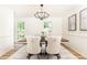 Elegant dining room featuring a modern chandelier, art, and comfortable seating at 2730 Burtz Dr, Marietta, GA 30068