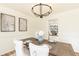 Elegant dining room features a modern chandelier, artwork, and comfortable seating at 2730 Burtz Dr, Marietta, GA 30068