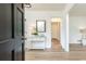 Inviting entryway features a console table with decor, wood flooring, and a view into other rooms at 2730 Burtz Dr, Marietta, GA 30068