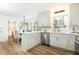 Modern kitchen with white cabinets, stainless steel appliances, and plank flooring at 2730 Burtz Dr, Marietta, GA 30068