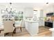 Open kitchen and dining area with white cabinets, stainless appliances, and natural light at 2730 Burtz Dr, Marietta, GA 30068