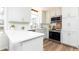 Bright kitchen features white countertops, stainless steel appliances, and wood flooring at 2730 Burtz Dr, Marietta, GA 30068