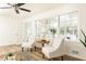 Cozy living room featuring large windows, plank floors, and comfortable seating at 2730 Burtz Dr, Marietta, GA 30068
