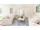 Cozy living room with neutral furniture, a patterned rug, and view into the hallway at 2730 Burtz Dr, Marietta, GA 30068