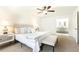 The main bedroom has neutral carpet and adjoins the main bathroom with dual sink vanity at 2730 Burtz Dr, Marietta, GA 30068