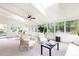 Bright sunroom with skylights, walls of windows, neutral decor, and ceiling fan at 2730 Burtz Dr, Marietta, GA 30068