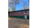 This house has a brick back and a large flat lawn at 3178 Beech Dr, Decatur, GA 30032