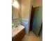 Cozy bathroom featuring single sink vanity with ceramic tile walls at 3178 Beech Dr, Decatur, GA 30032