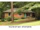Charming brick home featuring a covered carport and a quaint front door at 3178 Beech Dr, Decatur, GA 30032