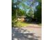 A charming brick home with an attached carport and a well-maintained front yard at 3178 Beech Dr, Decatur, GA 30032