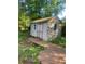 Charming outdoor shed with double doors, nestled among the trees with a wooden walkway at 3178 Beech Dr, Decatur, GA 30032