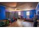 Spacious bedroom with hardwood floors and playful blue and purple decor at 8053 Duralee Ln, Douglasville, GA 30134