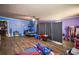 Spacious bedroom with hardwood floors and playful blue and purple decor at 8053 Duralee Ln, Douglasville, GA 30134