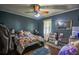 Comfortable bedroom with hardwood floors, ceiling fan, and natural light from the window at 8053 Duralee Ln, Douglasville, GA 30134