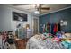 Cozy bedroom featuring hardwood floors, a ceiling fan, and ample storage space at 8053 Duralee Ln, Douglasville, GA 30134