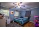 Blue bedroom with a bed and blue decorations at 8053 Duralee Ln, Douglasville, GA 30134