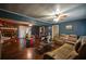 Bright living room features hardwood floors, comfortable seating, and a versatile layout, perfect for Gathering gatherings and relaxation at 8053 Duralee Ln, Douglasville, GA 30134
