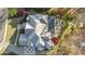 Aerial view of a home with a large stone patio and outdoor seating area at 1125 Lake Shore Overlook, Alpharetta, GA 30005
