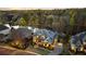 Aerial view of a luxury home with lake views and lush landscaping at 1125 Lake Shore Overlook, Alpharetta, GA 30005