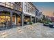 Spacious backyard with multiple outdoor lounge areas and lovely stonework at 1125 Lake Shore Overlook, Alpharetta, GA 30005