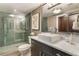 Bathroom featuring a glass enclosed shower and a marble vanity with a modern sink at 1125 Lake Shore Overlook, Alpharetta, GA 30005