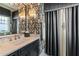 Elegant bathroom features patterned wallpaper, marble countertops, and modern fixtures at 1125 Lake Shore Overlook, Alpharetta, GA 30005