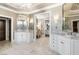 Elegant bathroom featuring double vanities, marble floors, and stunning light fixtures at 1125 Lake Shore Overlook, Alpharetta, GA 30005