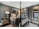 Bedroom features a four-poster bed, soft colors, and a private balcony at 1125 Lake Shore Overlook, Alpharetta, GA 30005