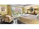 A sunlit bedroom featuring a large window offering peaceful views of the outdoors at 1125 Lake Shore Overlook, Alpharetta, GA 30005
