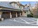 Beautiful estate home with a stone driveway and three-car garage at 1125 Lake Shore Overlook, Alpharetta, GA 30005
