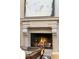 Close up view of the stone fireplace with mantle at 1125 Lake Shore Overlook, Alpharetta, GA 30005