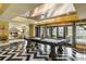 Spacious game room featuring a pool table, modern lighting, and access to outdoor seating at 1125 Lake Shore Overlook, Alpharetta, GA 30005