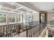Hallway with tray ceilings, a modern railing, and large windows offering lots of natural light at 1125 Lake Shore Overlook, Alpharetta, GA 30005