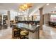 Spacious kitchen with stainless steel appliances and a large island with barstool seating at 1125 Lake Shore Overlook, Alpharetta, GA 30005