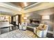 Modern living room with sleek fireplace, stylish chairs, and contemporary decor at 1125 Lake Shore Overlook, Alpharetta, GA 30005