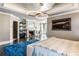 Relaxing primary bedroom boasts a fireplace, modern lighting, and an adjacent sitting area at 1125 Lake Shore Overlook, Alpharetta, GA 30005