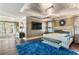 Spacious primary bedroom has a luxurious feel with an oversized bed and an ample amount of natural light at 1125 Lake Shore Overlook, Alpharetta, GA 30005