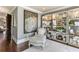 Sitting area with display shelves, comfortable seating, and a beautiful art piece at 1125 Lake Shore Overlook, Alpharetta, GA 30005