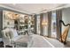 Cozy sitting area with harp, mirrored display shelves, and natural light from large windows at 1125 Lake Shore Overlook, Alpharetta, GA 30005