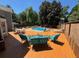 Inviting backyard deck with outdoor seating and a view of the refreshing in-ground pool at 1153 Staples Sw Dr, Lilburn, GA 30047