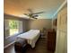 Bedroom with wood floors, ceiling fan, and natural lighting at 1153 Staples Sw Dr, Lilburn, GA 30047