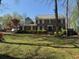 Charming two-story home with manicured lawn and traditional architecture at 1153 Staples Sw Dr, Lilburn, GA 30047
