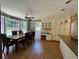 Bright and airy kitchen featuring a dining area, granite countertops and ample cabinetry at 1153 Staples Sw Dr, Lilburn, GA 30047