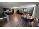 Large living area with hardwood floors, kitchenette, seating, and natural light at 1153 Staples Sw Dr, Lilburn, GA 30047