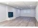 Spacious basement with modern flooring, a cozy fireplace, and plenty of room for activities at 317 Community Sw Dr, Mableton, GA 30126