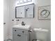 This is a modern bathroom featuring sleek fixtures, minimalist design, and ample lighting at 317 Community Sw Dr, Mableton, GA 30126