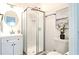 Well-lit bathroom features a vanity, shower, and toilet, accented by modern fixtures and decor at 317 Community Sw Dr, Mableton, GA 30126